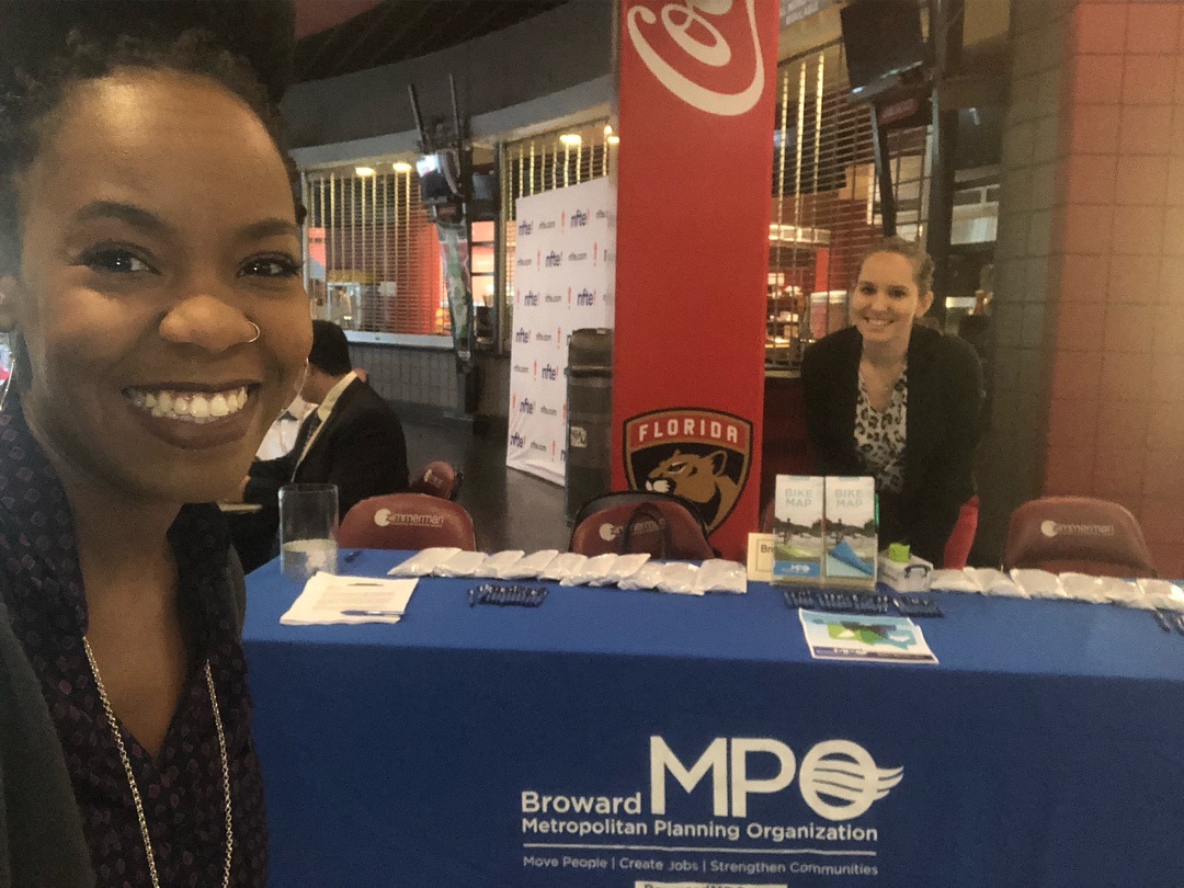 Two MPO staff greeting students at Claim Your Future Showcase